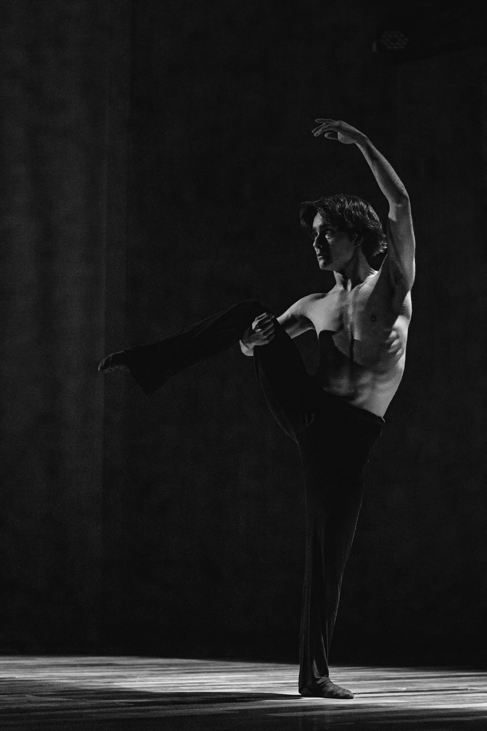 a black and white photo of a ballerina