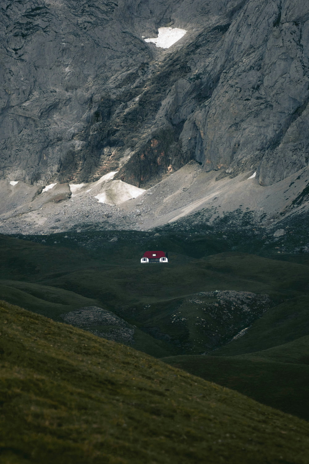 a couple of cars are parked in the mountains