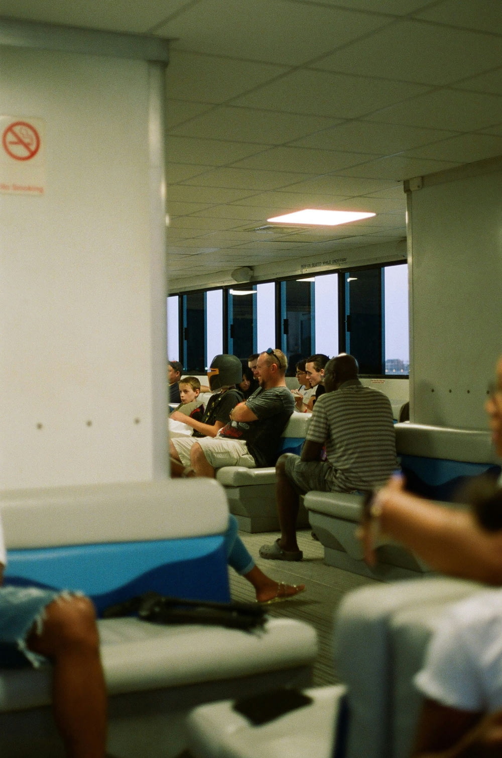 a group of people sitting in chairs in a room
