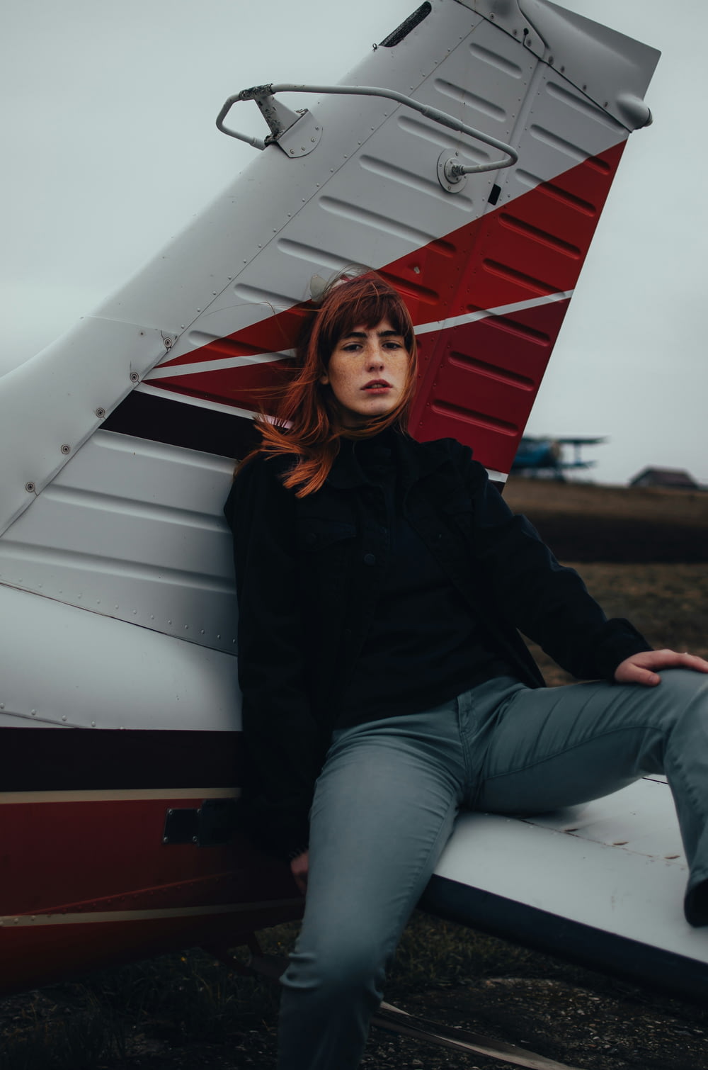 a woman is sitting on a small plane