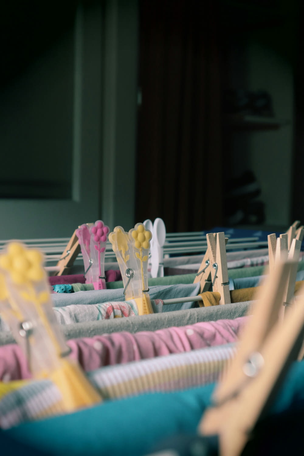 a row of clothes hanging on clothes pins