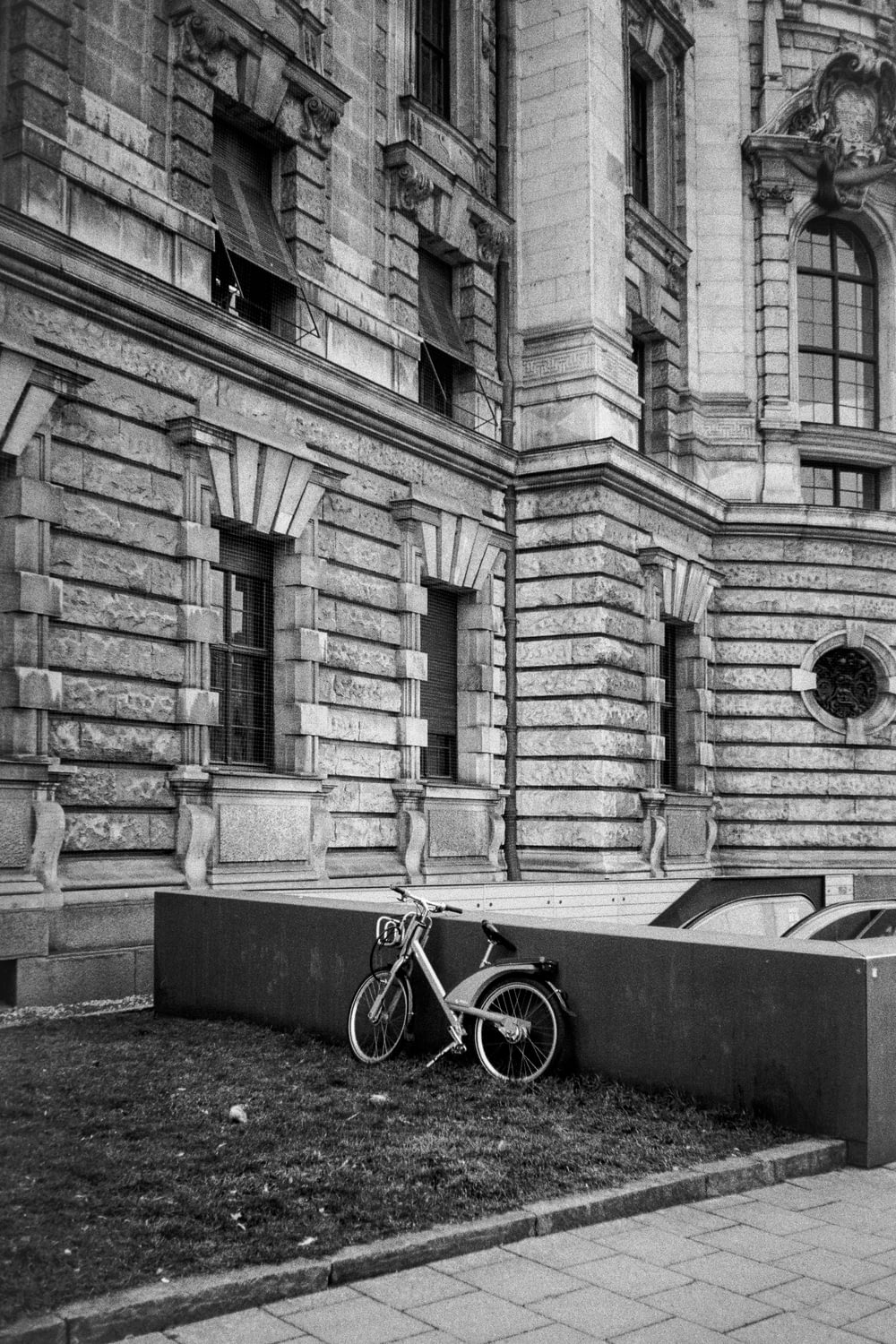 a bike is parked in front of a building
