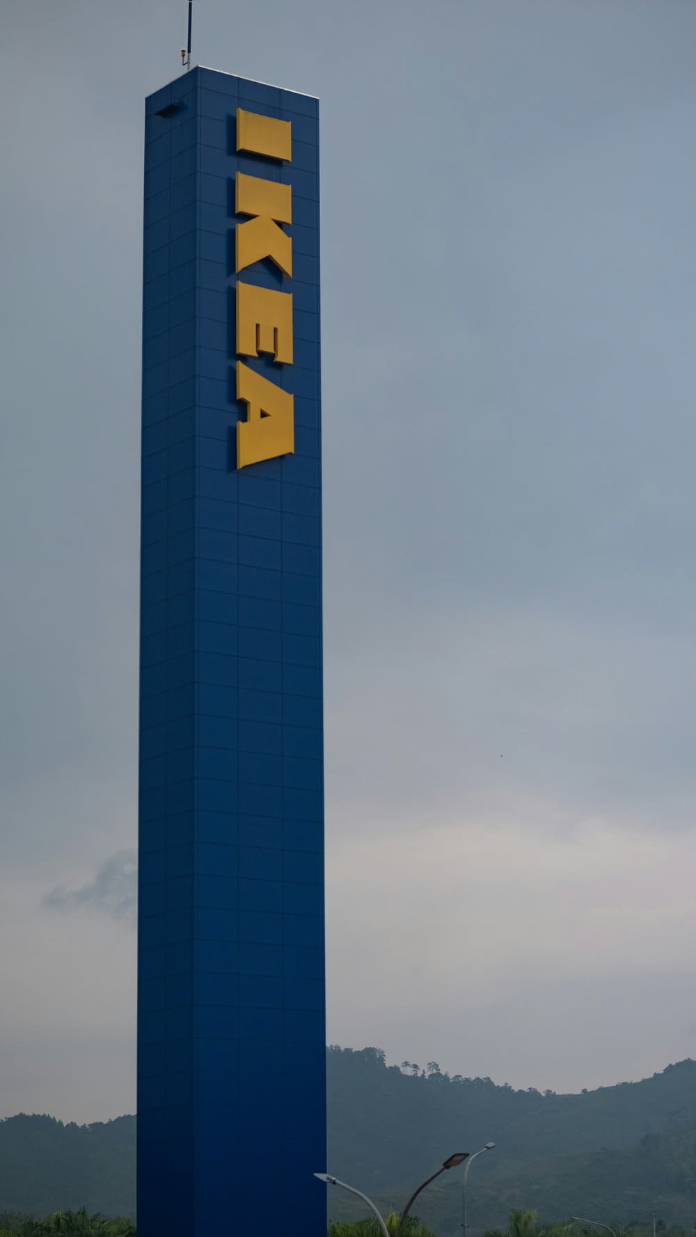 a tall blue building with the word ikea on it