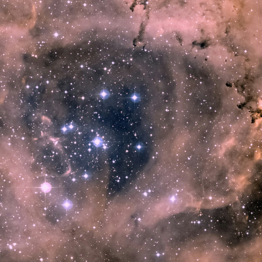 a very large star surrounded by stars in the sky