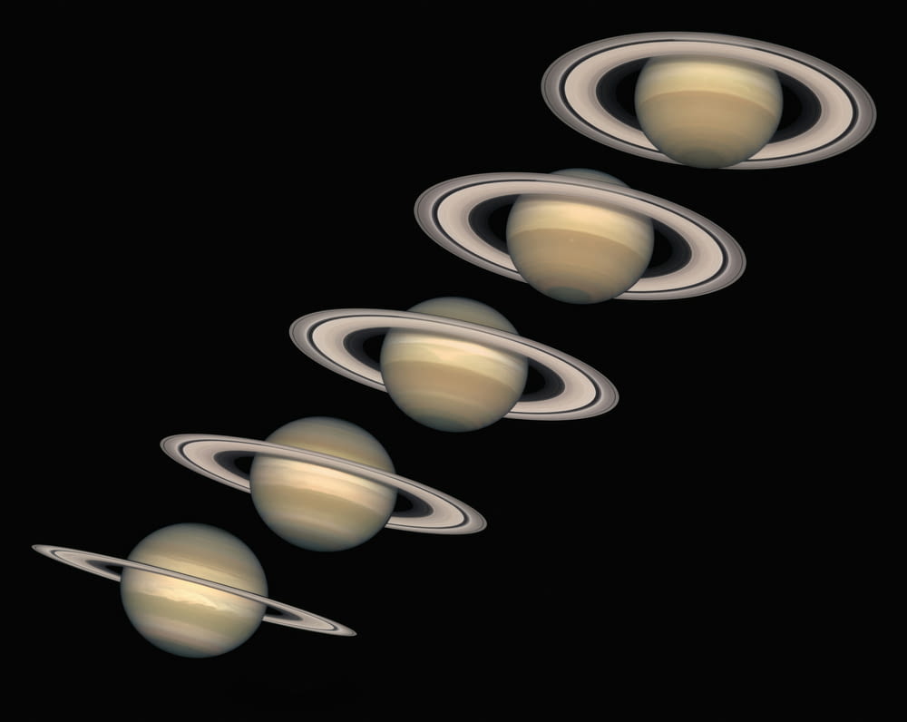 a group of saturns flying through the sky