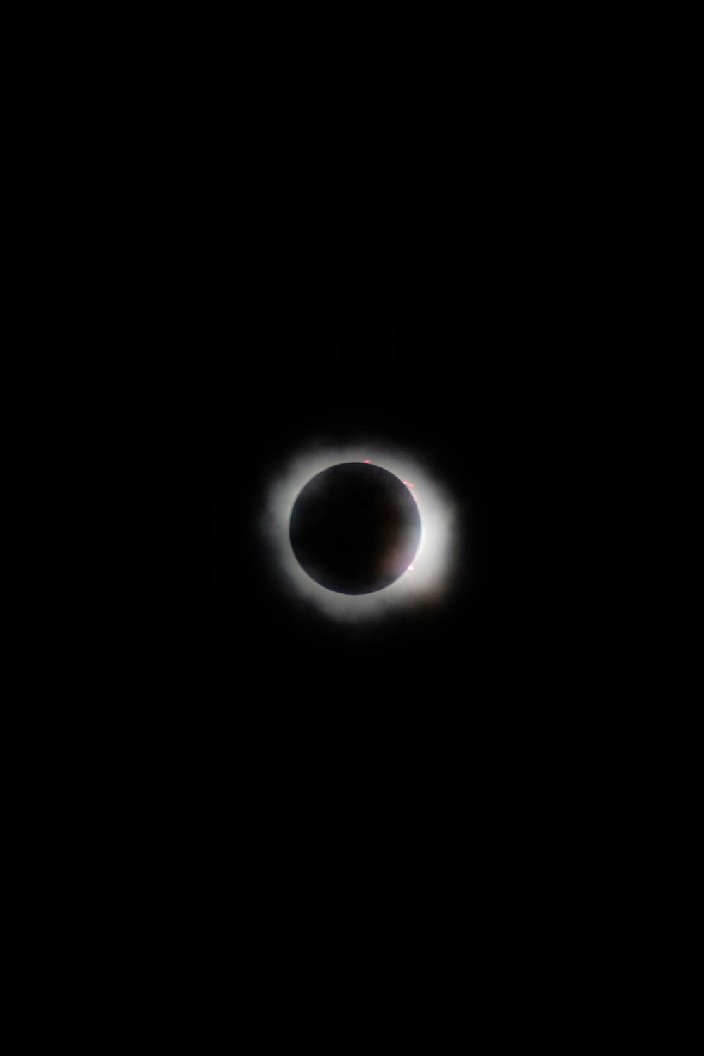 a eclipse in the sky with a black background