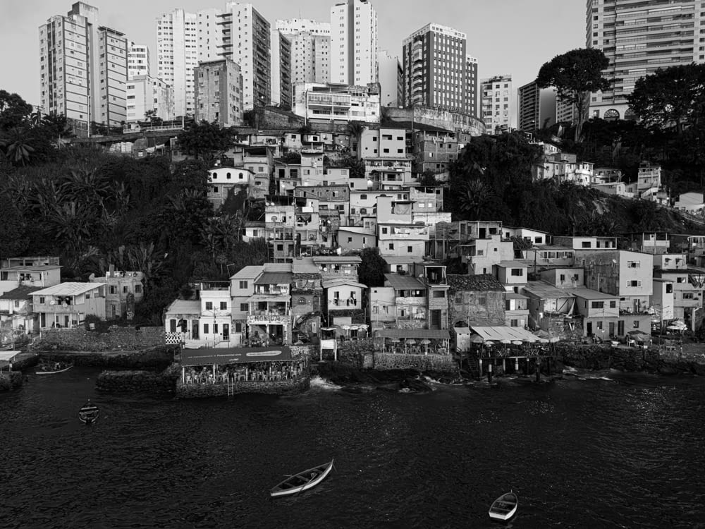 a black and white photo of a city with lots of buildings