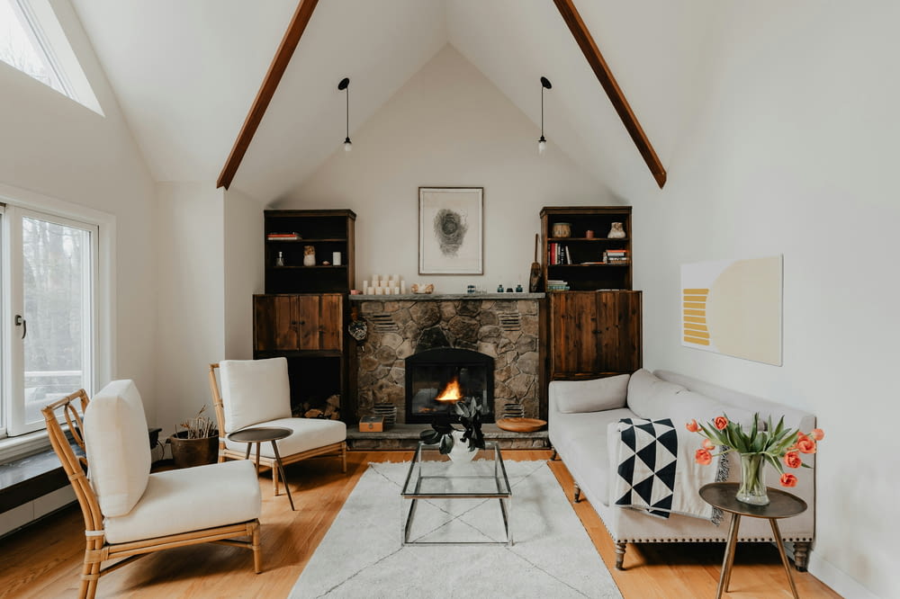 a living room filled with furniture and a fire place