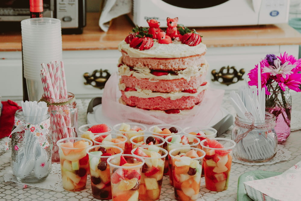 a cake with strawberries on top of it on a table