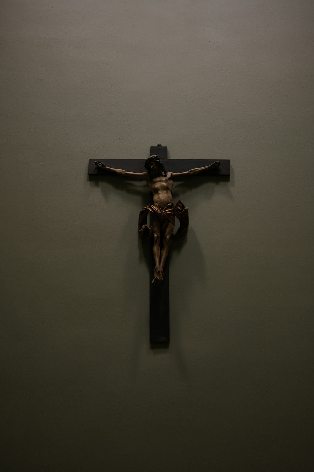a crucifix hanging on a wall in a room