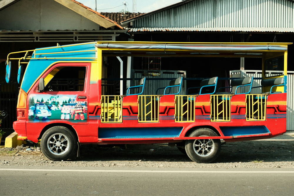a colorful bus parked on the side of the road