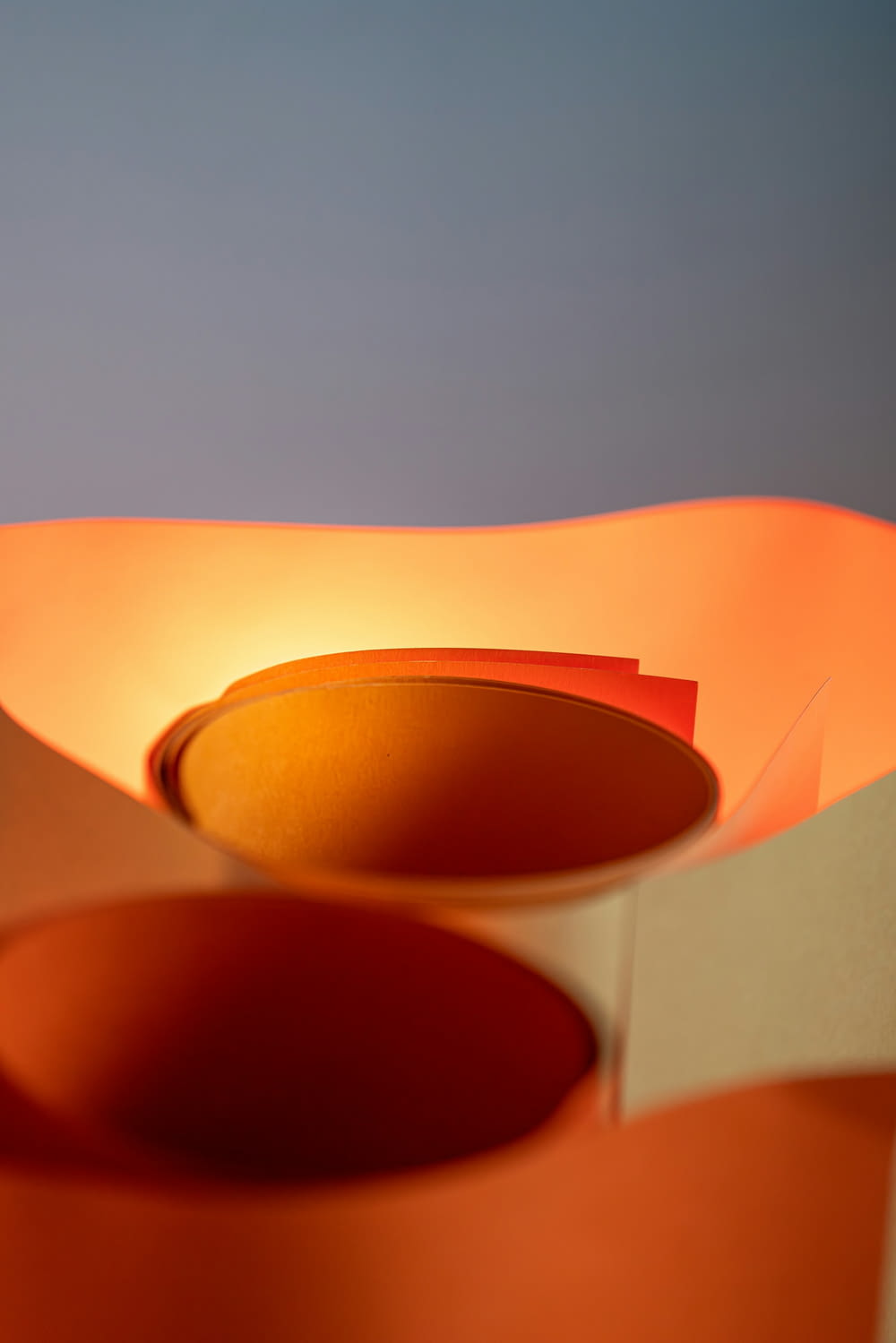 a close up of a light fixture with a blue sky in the background