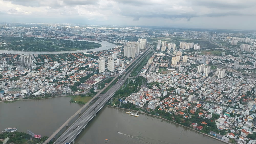 an aerial view of a city and a bridge