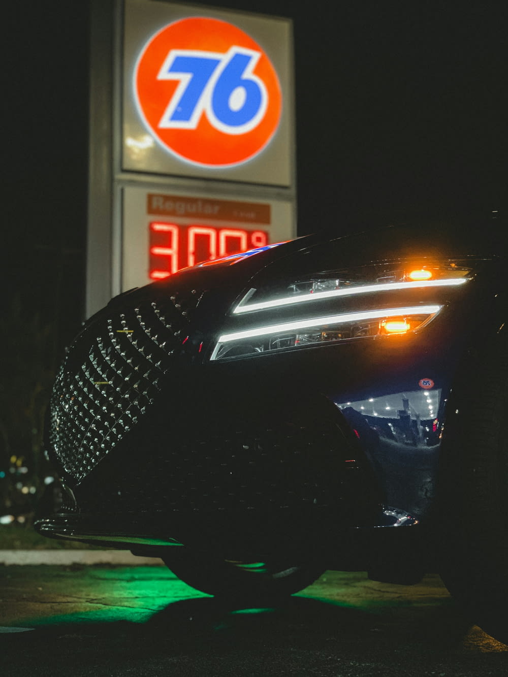a car parked in front of a gas station