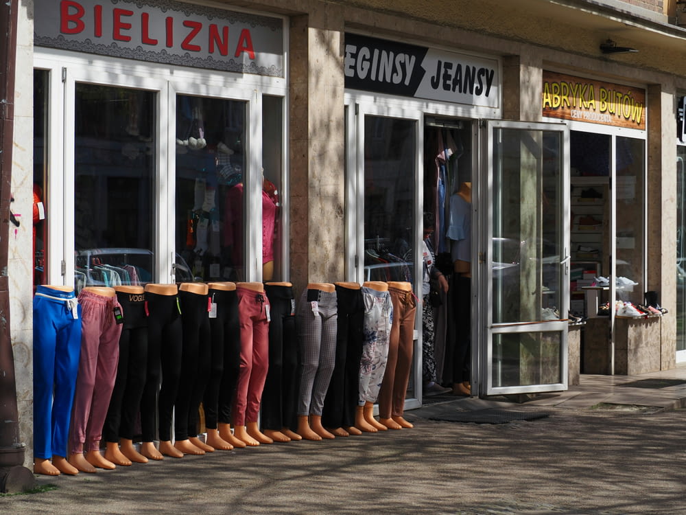 a row of boots are lined up outside of a store