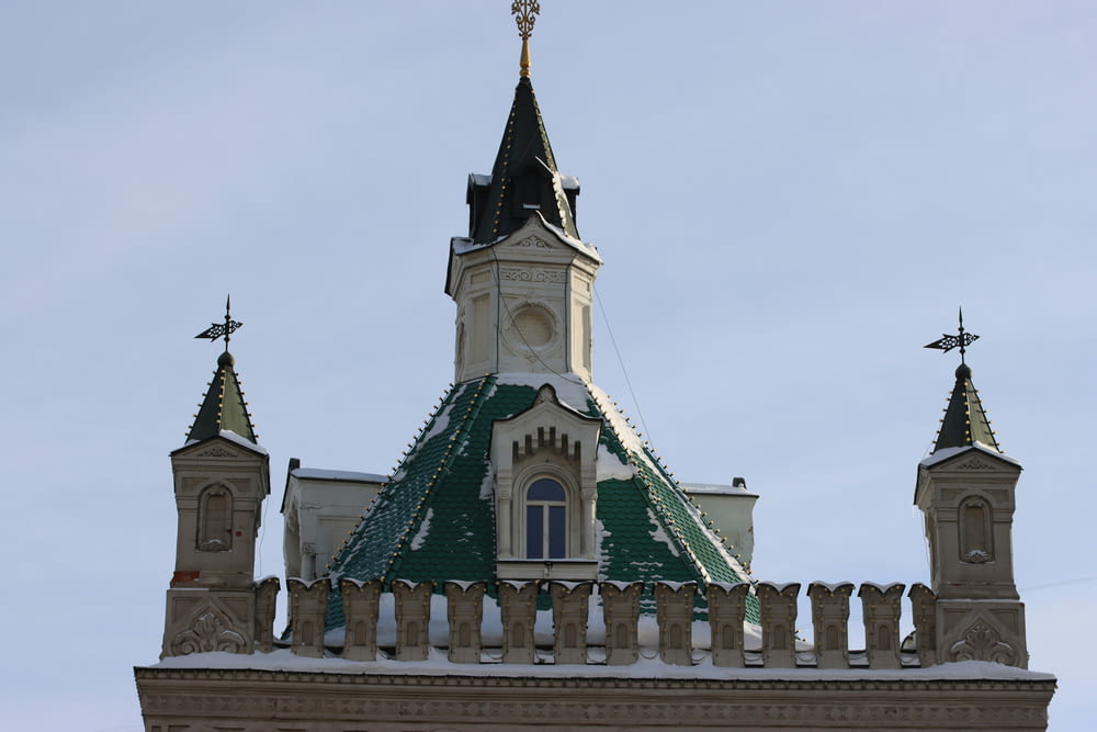 a building with a steeple and a cross on top