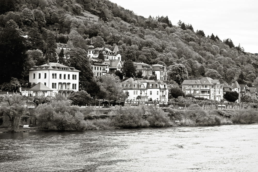a black and white photo of a town on a hill