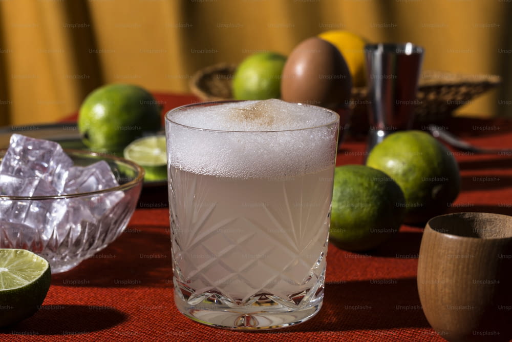 A glass of pisco sour cocktail