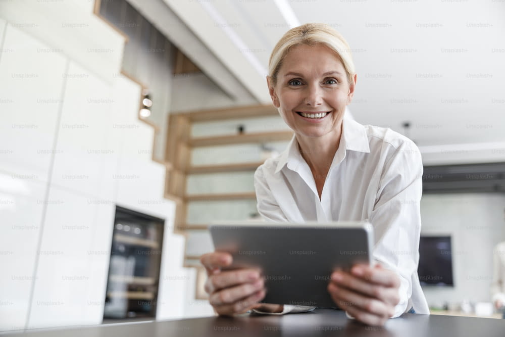 Pretty woman with digital tablet stock photo