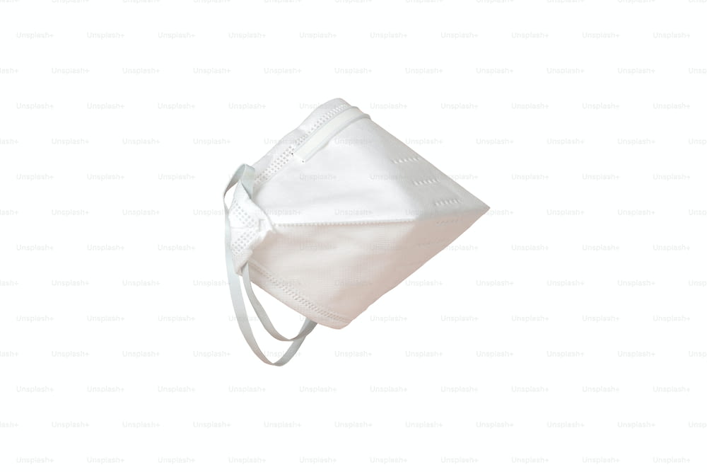Cut out white protective medical mask isolated on transparent background with copy space. Advertising of face respirator and medical fitler equipment