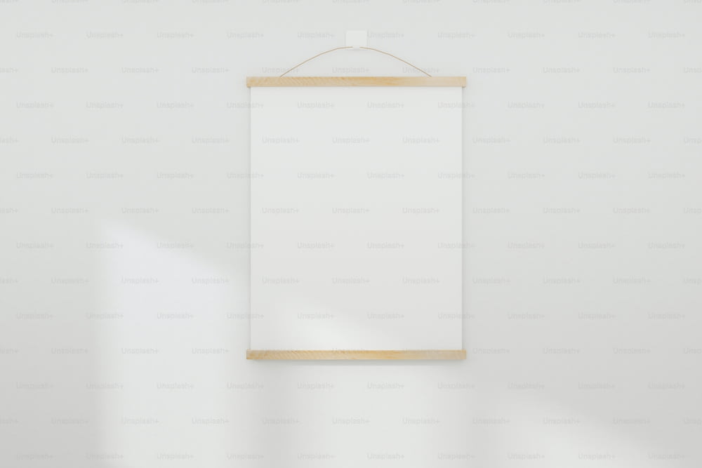 Mockup white realistic empty picture frame on white wall background. 3D Rendered.