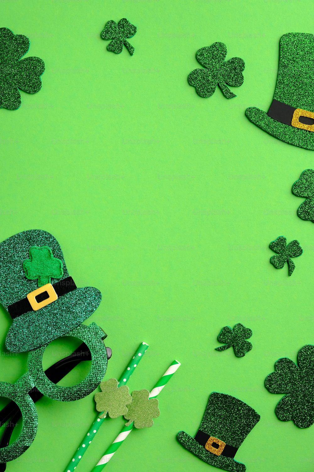 St Patrick's Day vertical banner design. Irish elf hats, shamrock leaves, party glasses on green background with copy space. Happy Saint Patricks Day concept