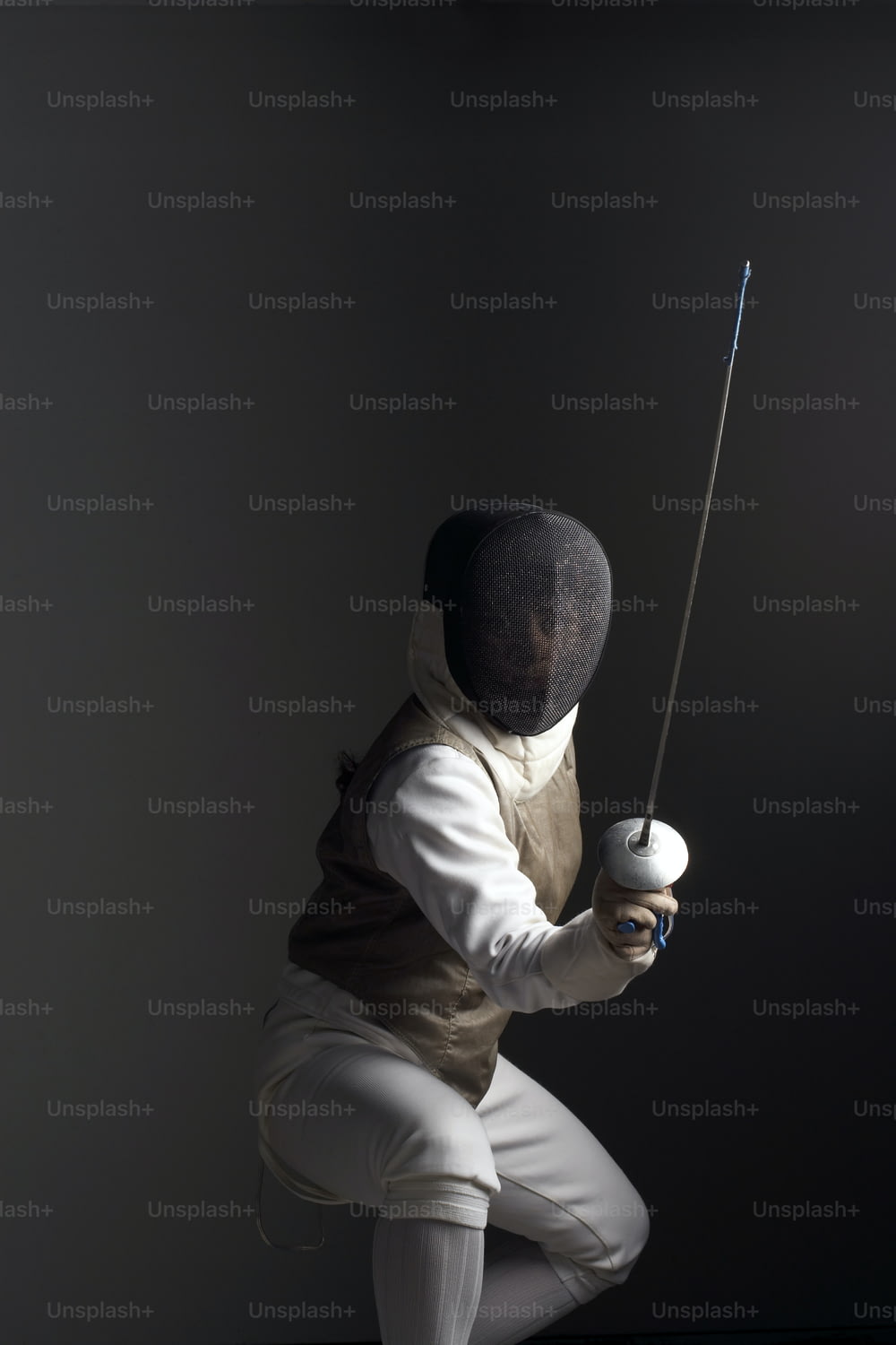 a man in a white suit holding a baseball bat