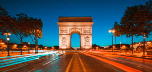 Famous Arc de Triomphe at night, Paris, France.