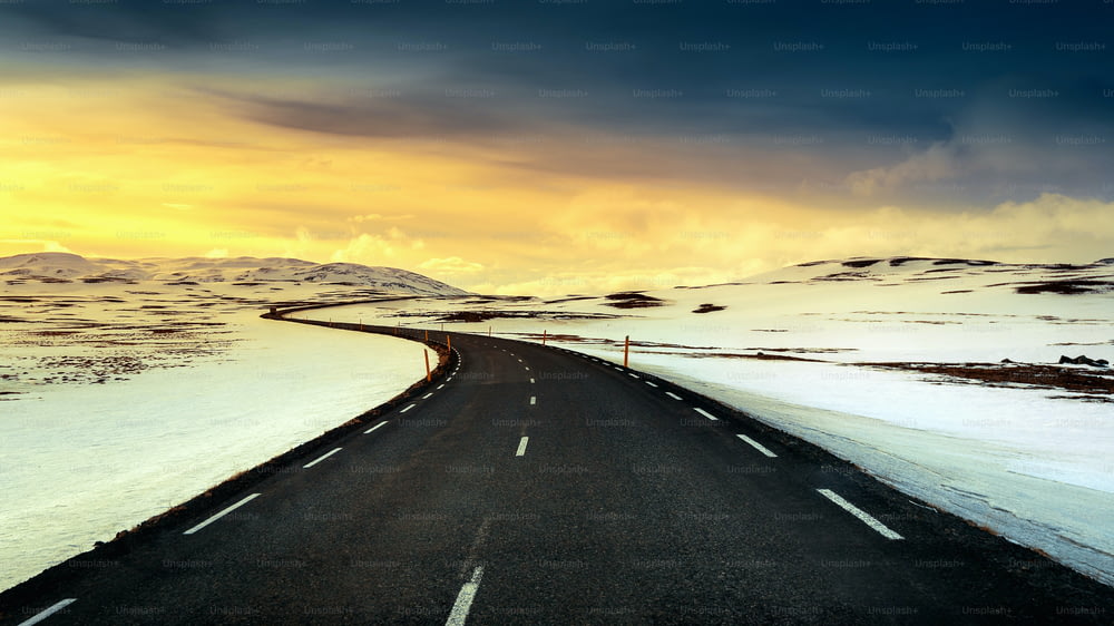 A long straight road at sunset in winter.