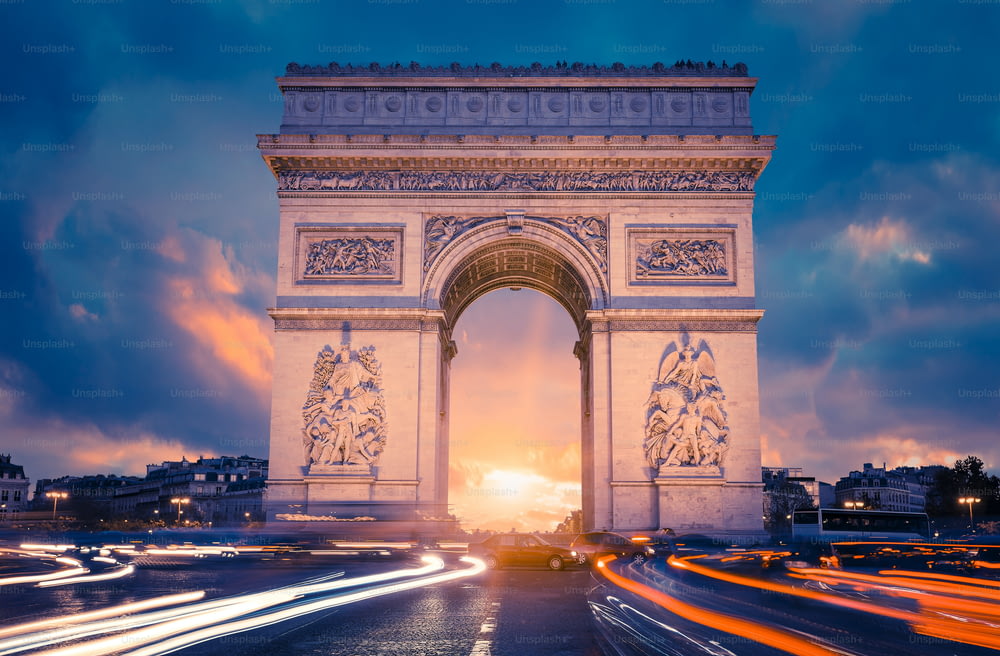 View of famous Arc de Triomphe at sunset, Paris