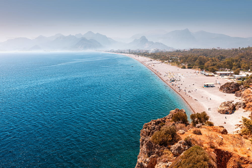Aerial view of the famous longest Konyaalti beach in Antalya. Vacation and tour on the Mediterranean coast of Turkey
