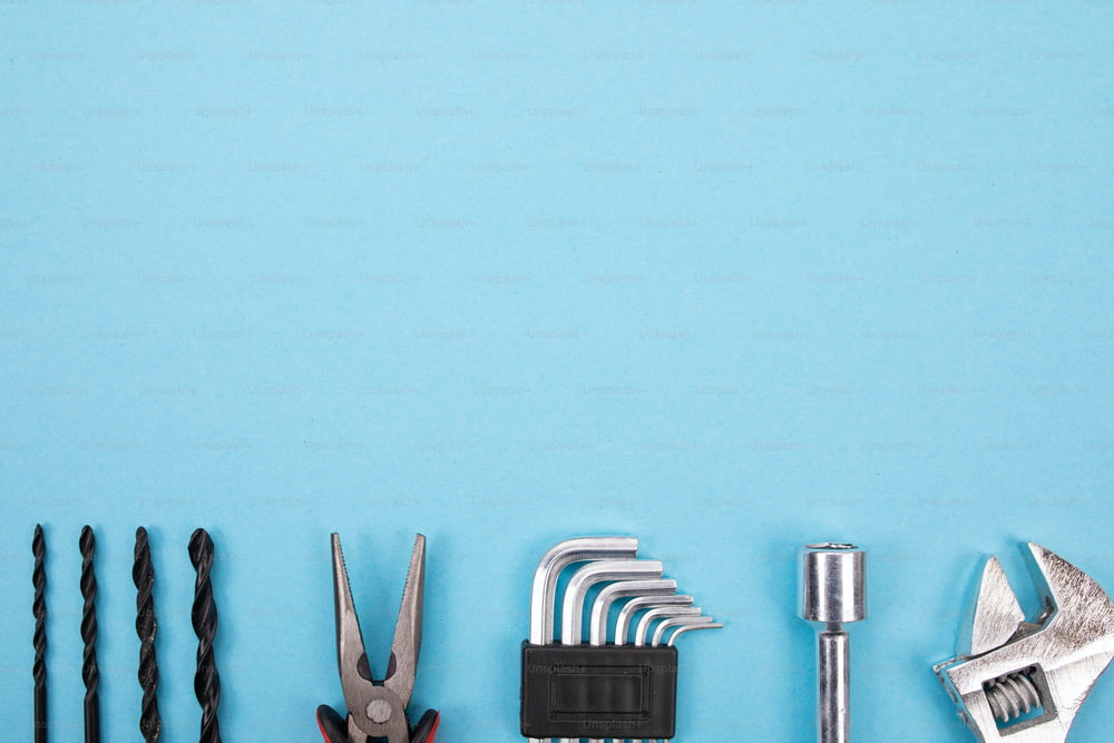 Mechanical set of different tools isolated on blue background