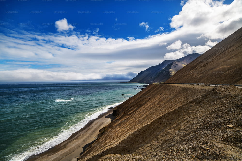 A beach, sea and mountain landscape in Iceland, Europe.