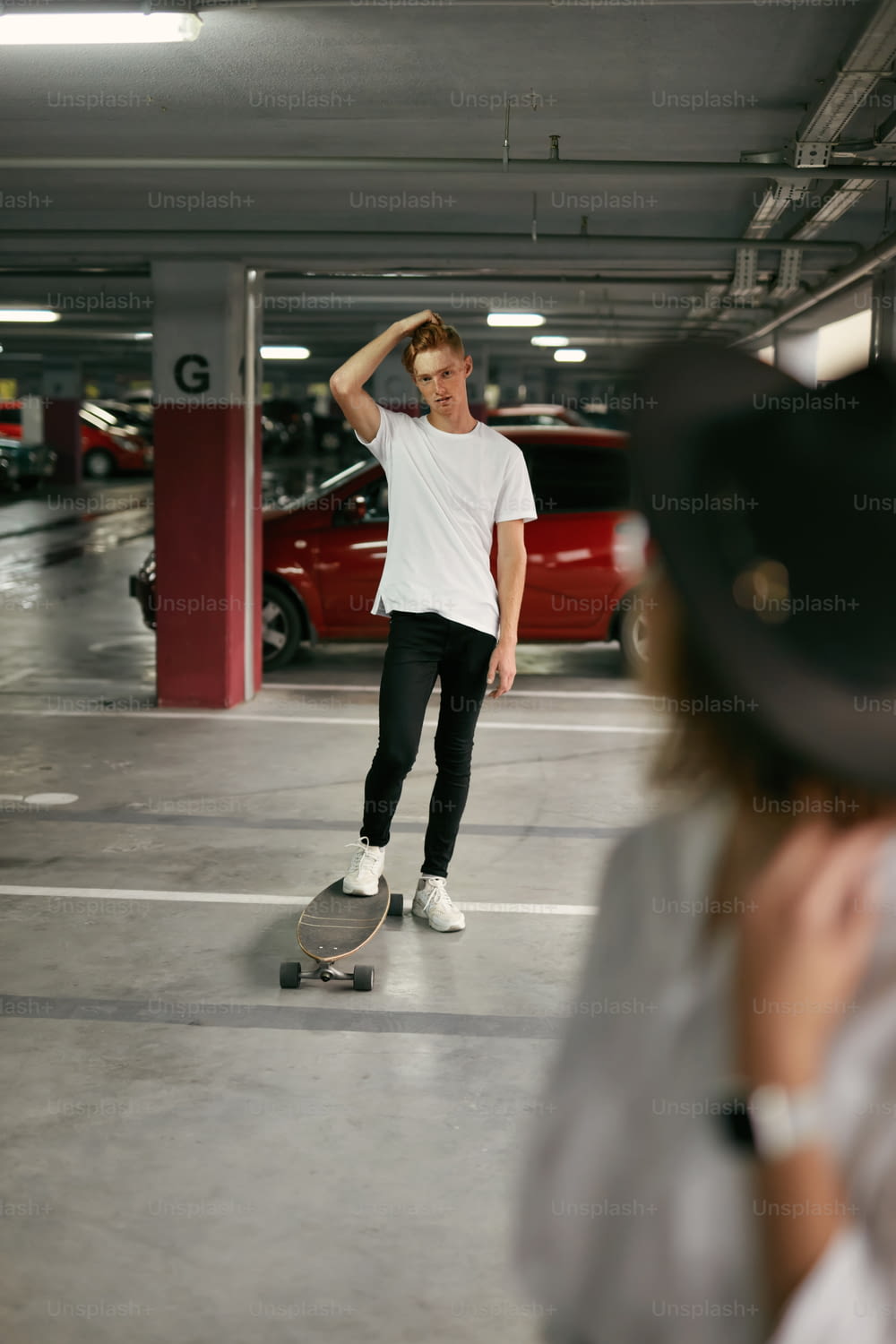 Young Man Riding On Skateboard At Parking In Shopping Center, Guy In Casual Clothes With Board. High Resolution
