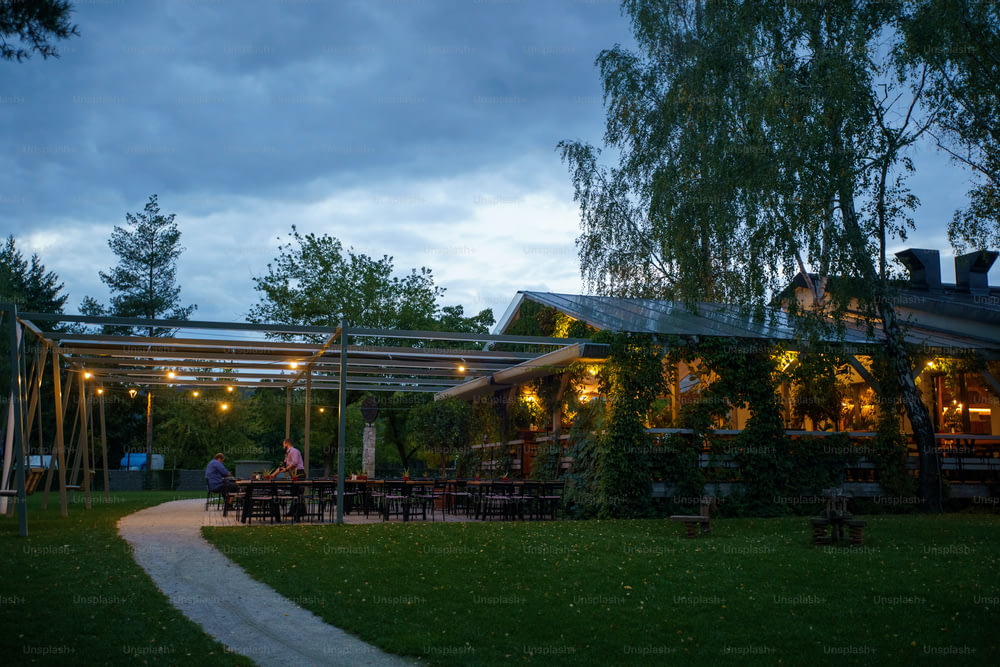 A modern restaurant with terrace in evening illumination