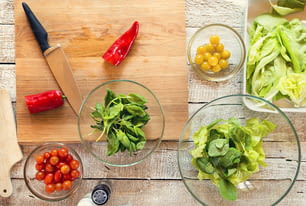 Ingredients for salad laid on wooden table background