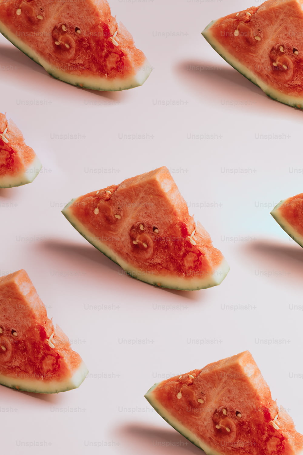 a group of slices of watermelon sitting on top of each other