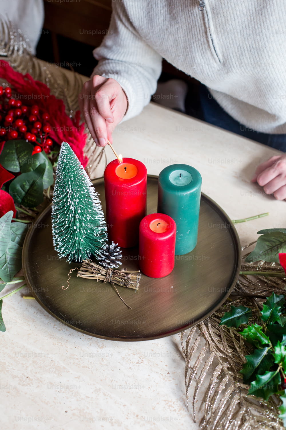 a plate with candles and a christmas tree on it