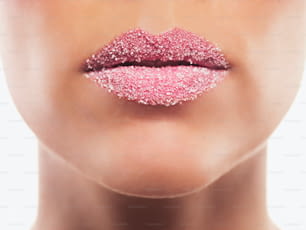 a woman's lips covered in pink glitter