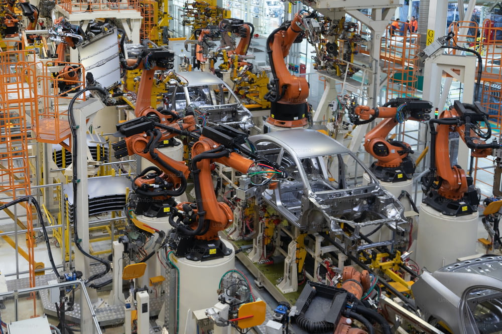 車の組み立ての現代技術。自動車産業の工場。機械の生産と組み立てのためのショップ 上面図。車の部品を溶接するプロセス