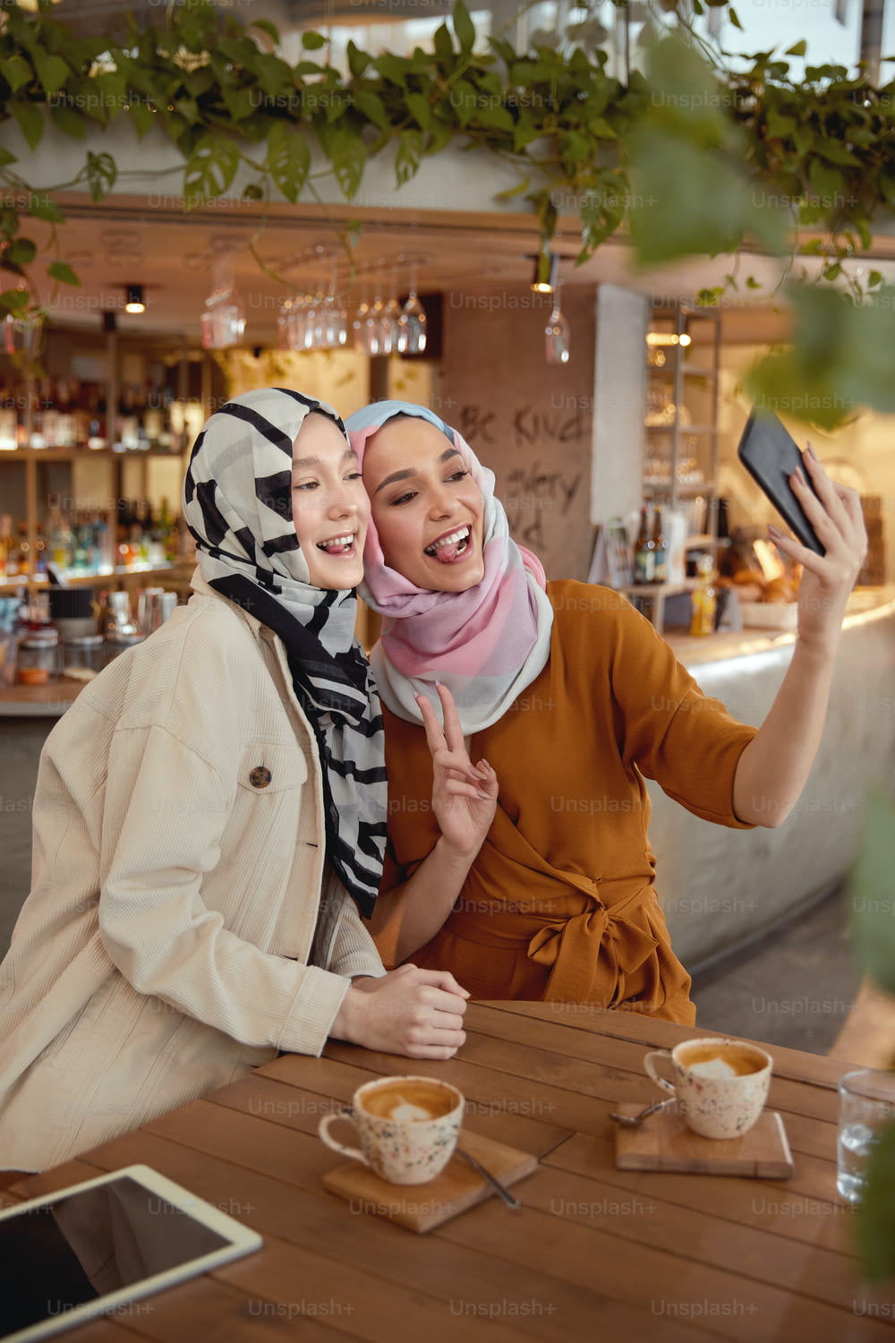 Friends. Women In Hijab Taking Selfie. Women Meeting In Cafe. Smiling Muslim Female Spending Time In Bistro.