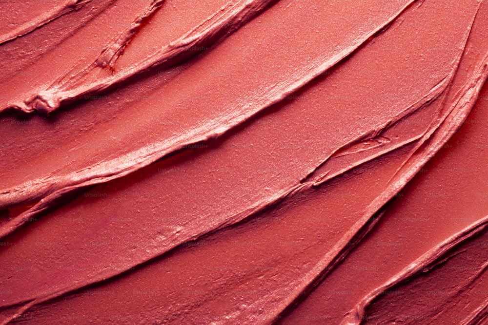 Sbavato e sbavato vibrante rosso arancione corallo viola scarlatto rosa bordeaux testurizzato tinta o rossetto sfondo multicolore