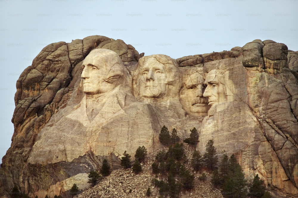 a group of presidents carved into the side of a mountain