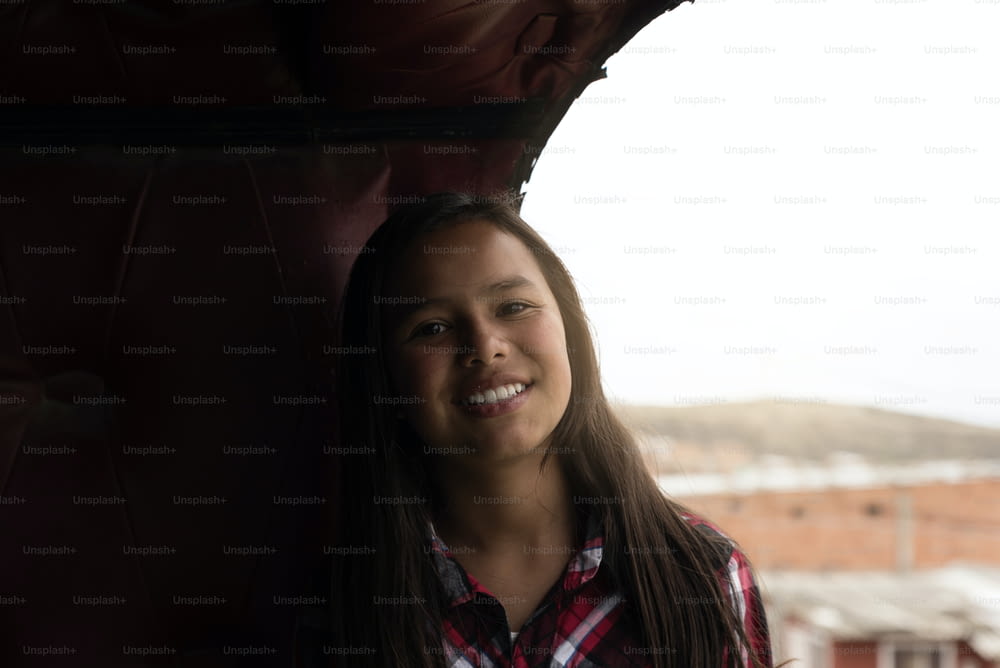 Portrait of cute latino girl inside the truck cabin. Childhood Concept.