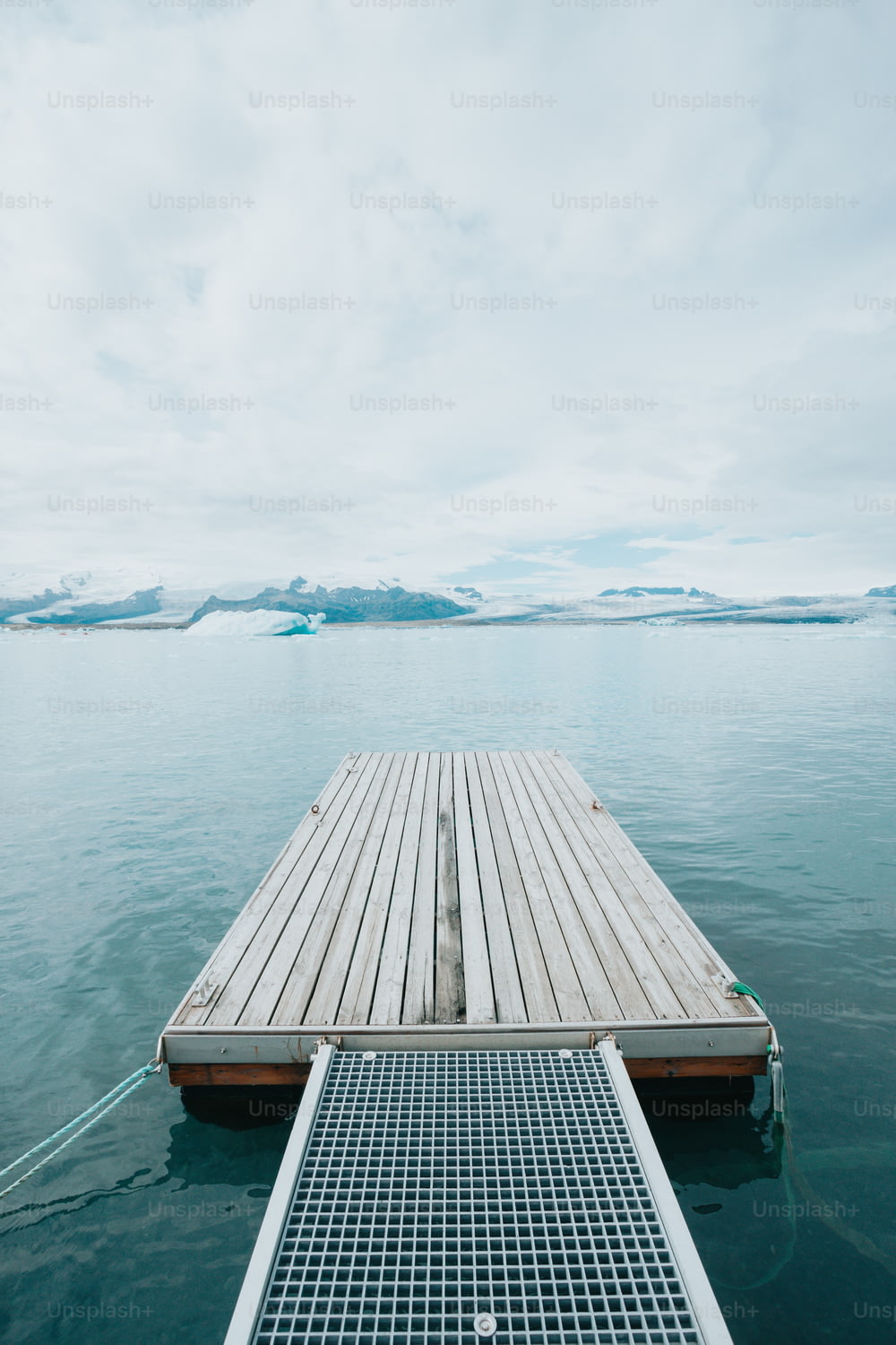 a wooden dock sitting in the middle of a body of water
