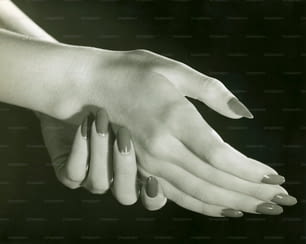 UNITED STATES - CIRCA 1950s:  Close-up shot of a woman's hands.