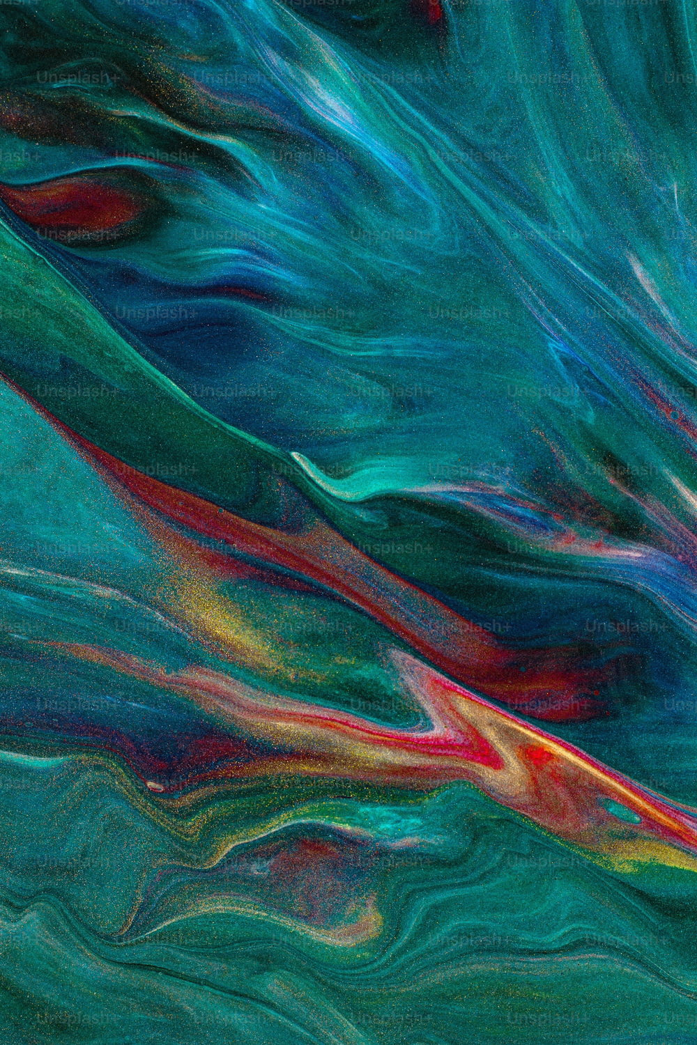 an abstract painting of blue, red, and green colors