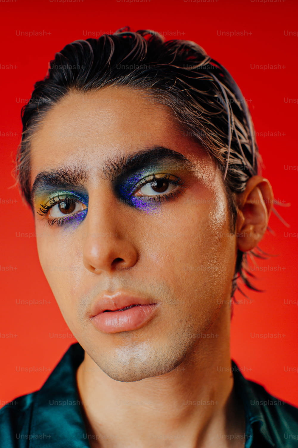a man with a blue and yellow make up