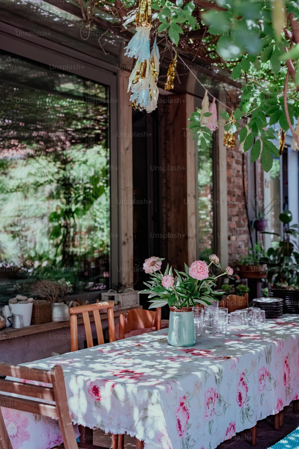 a table with a white and pink table cloth on it