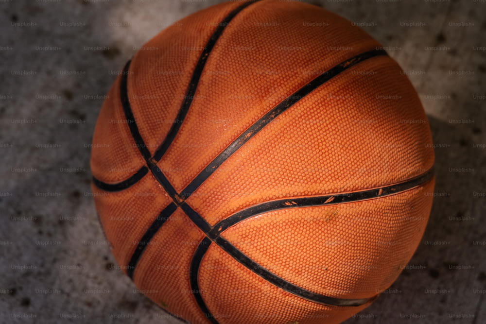 a close up of a basketball on the ground